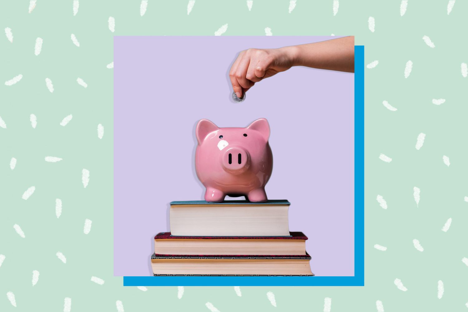 An image of a piggy bank on top of books.