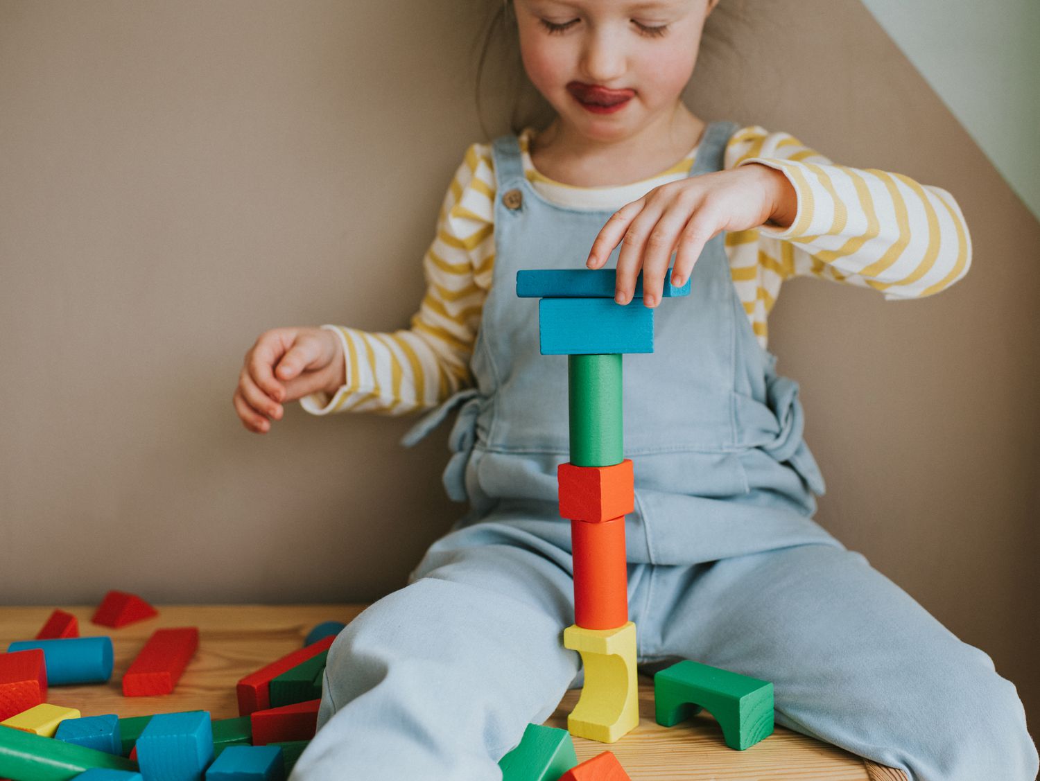 An image of a child playing with blocks.