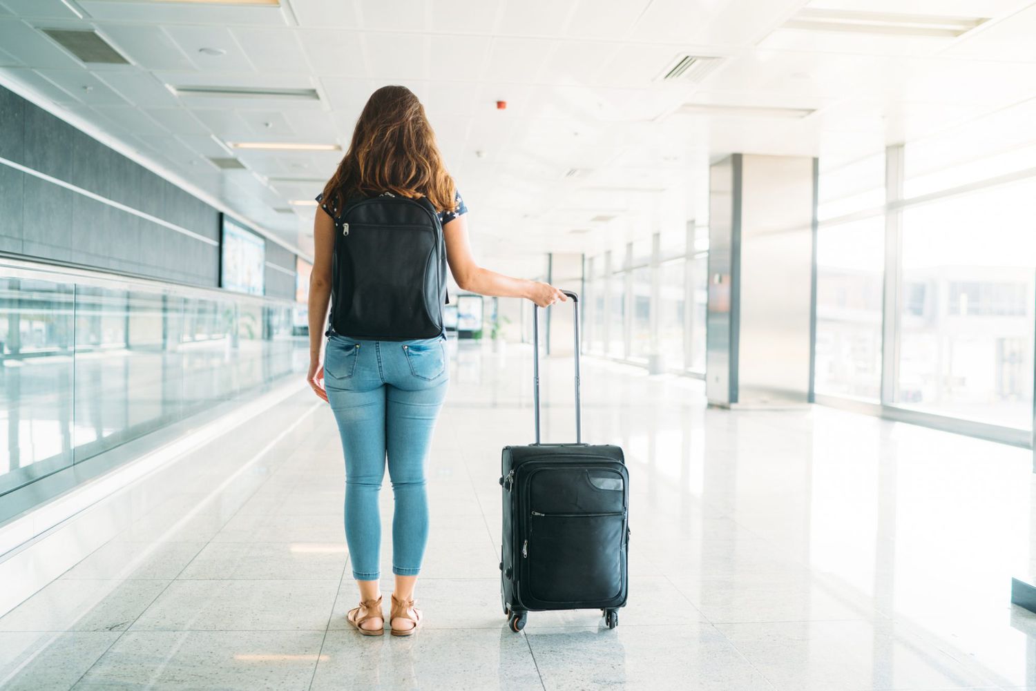 An image of a teen with a suitcase.