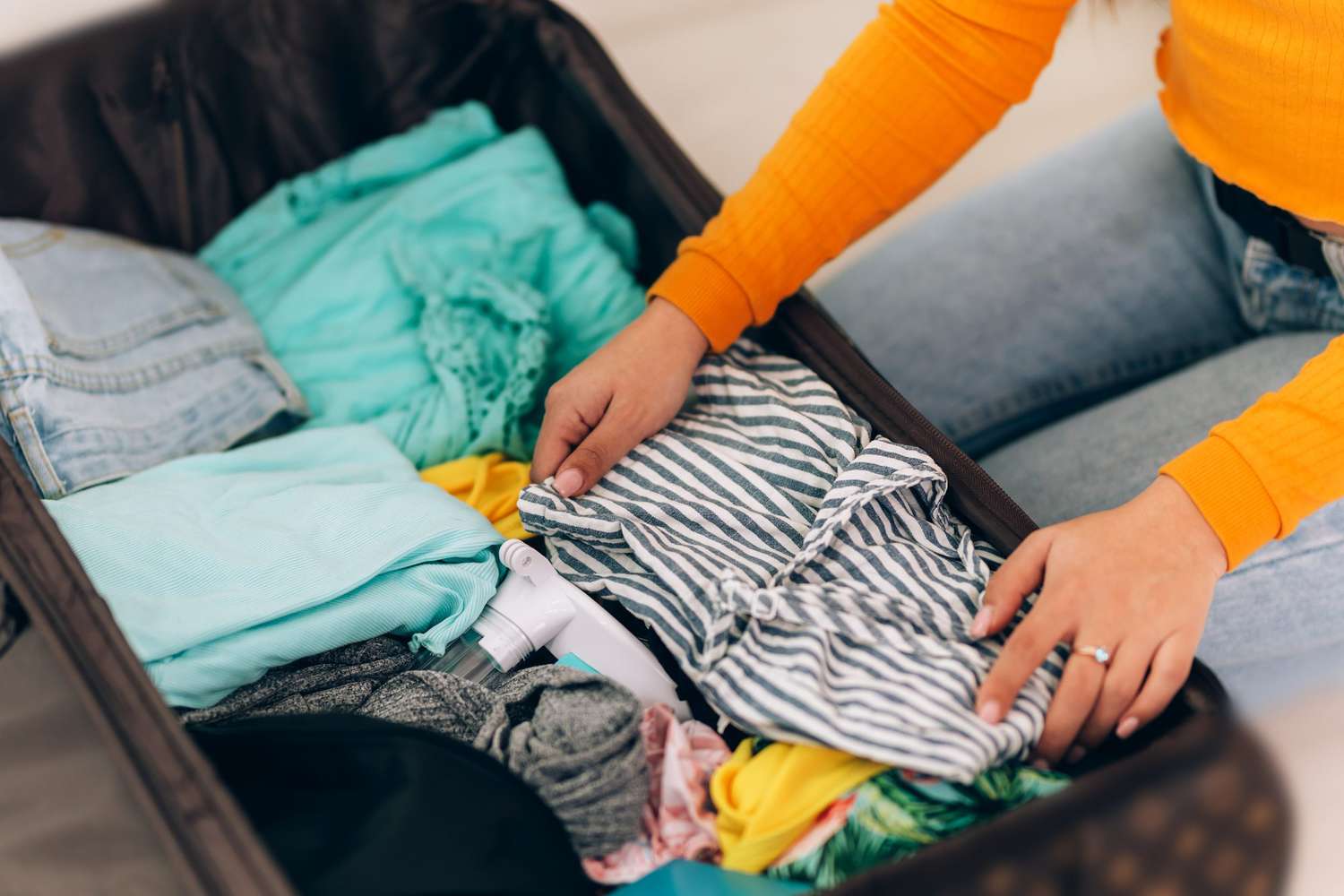An image of a girl packing.