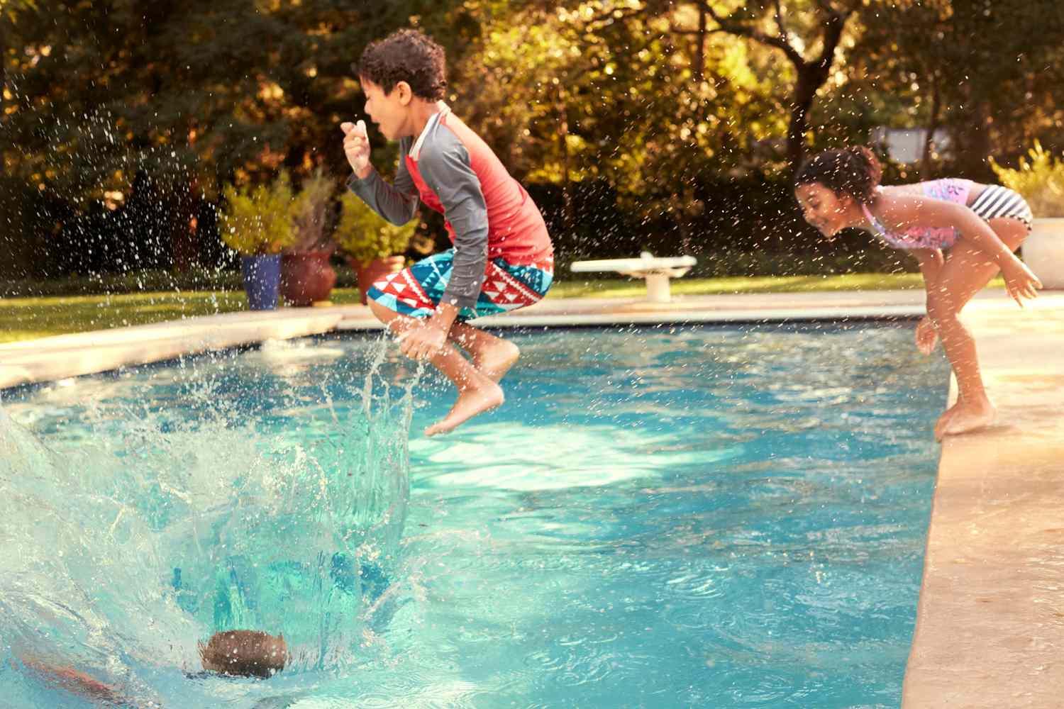 kids jumping in pool