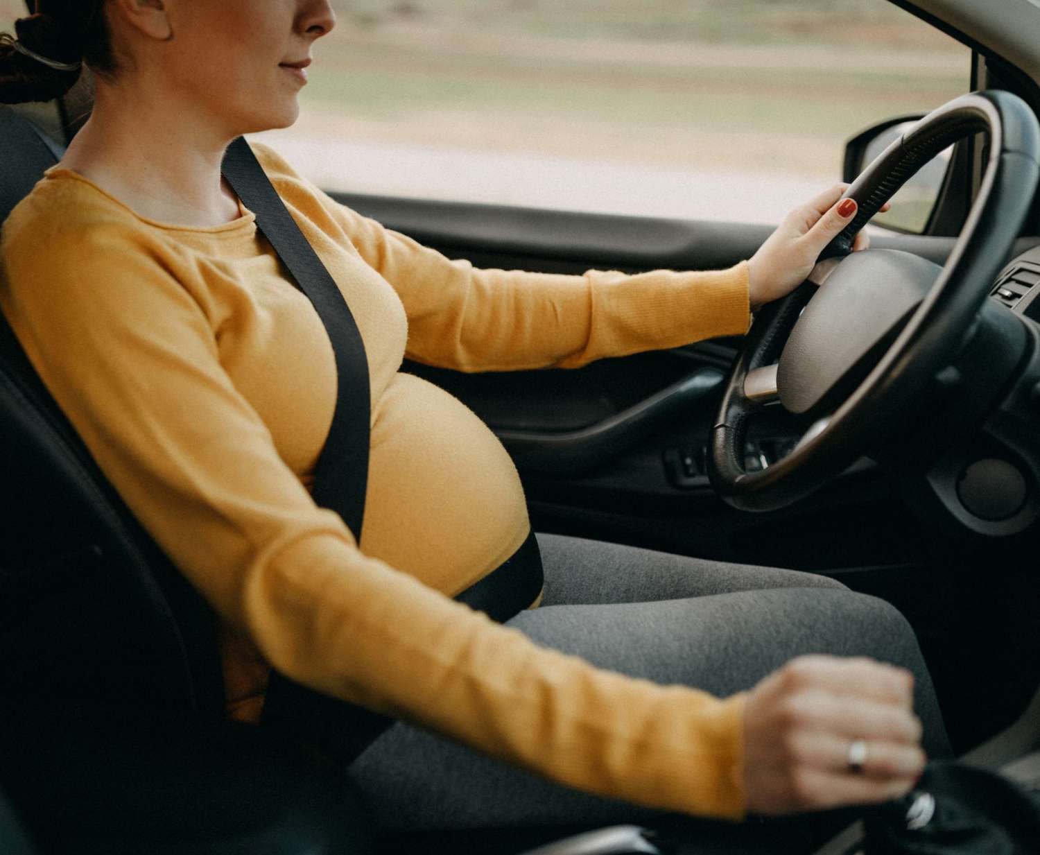 An image of a woman driving a car.