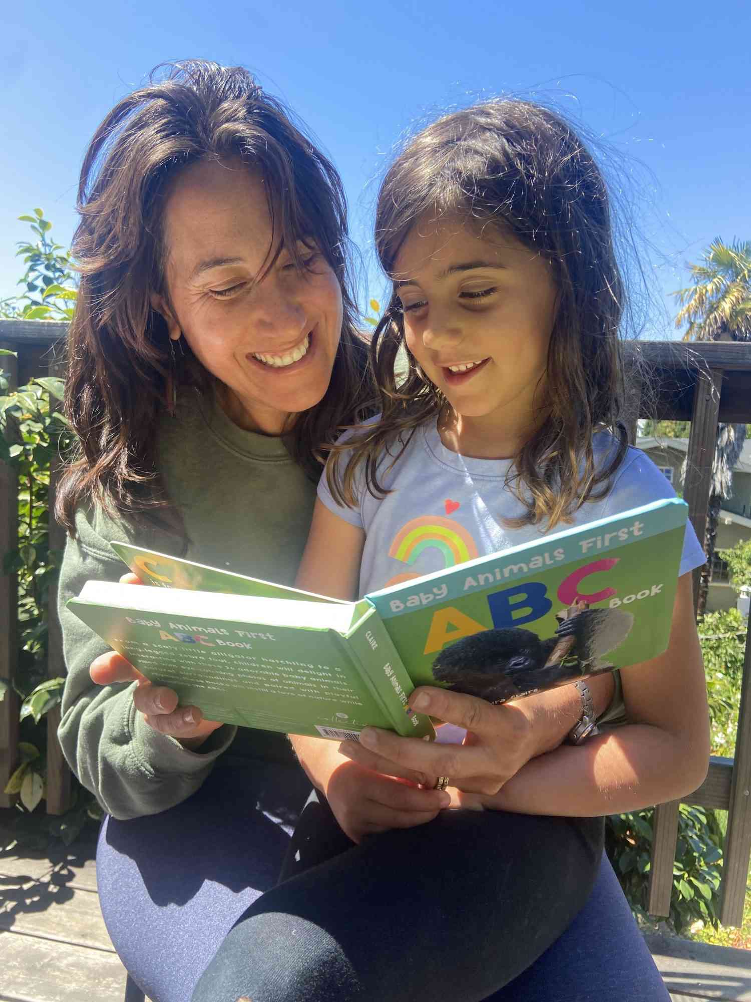 The author reading with her child.
