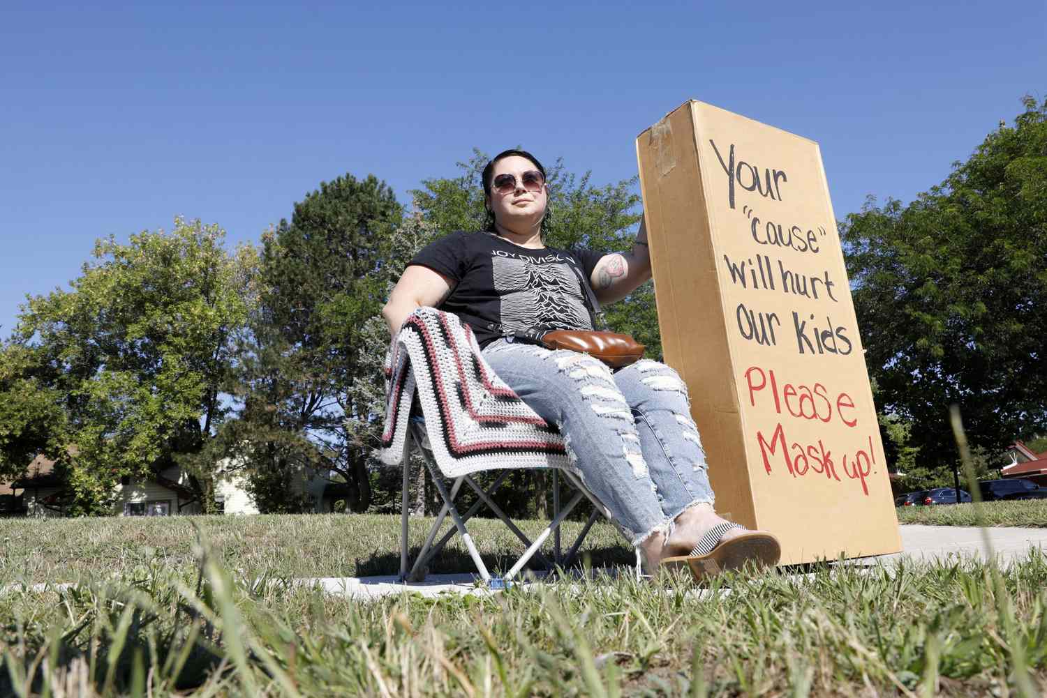 An image of a counter-protester across the street from a rally against the Midland Public Schools (MPS) mask mandates outside the MPS administration building in Midland, Michigan.