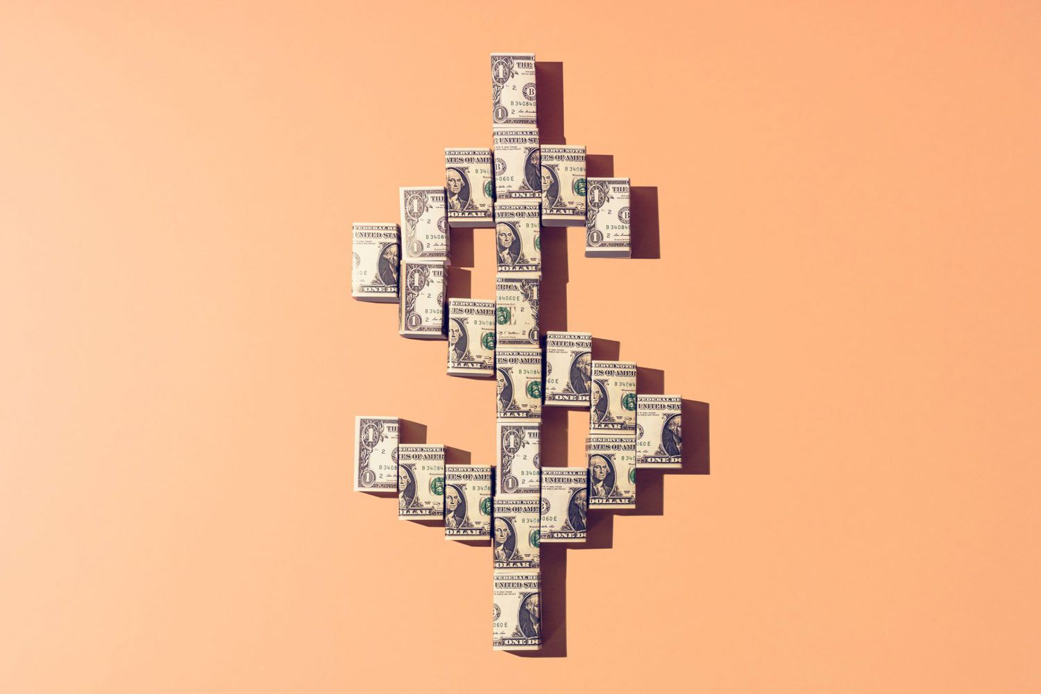 An image of dollar bills in the shape of a money sign.