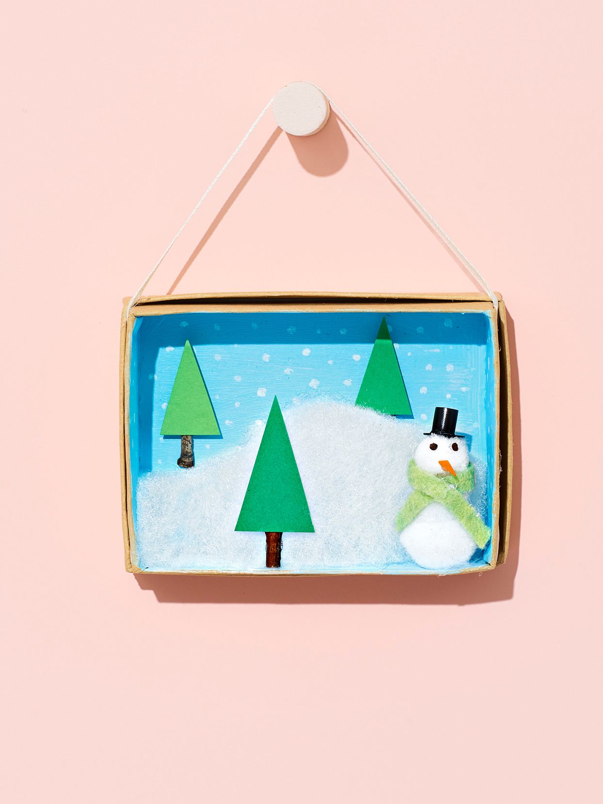 frosty in a frame ornament craft on pink background
