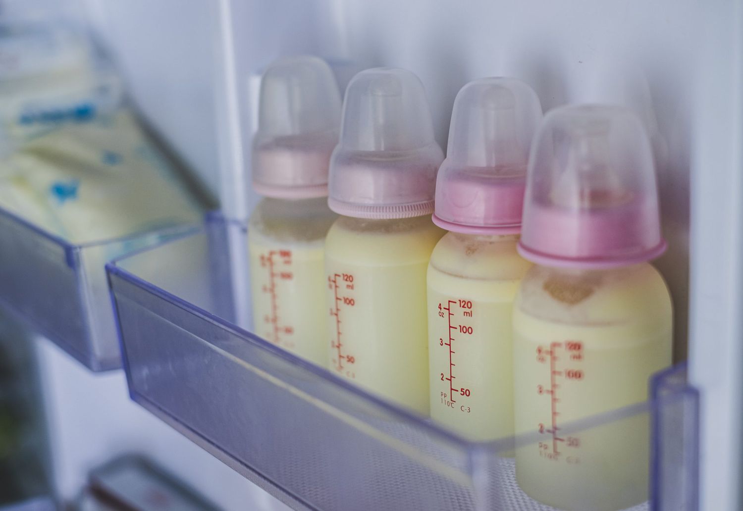 An image of a closeup of breast milk in a fridge.