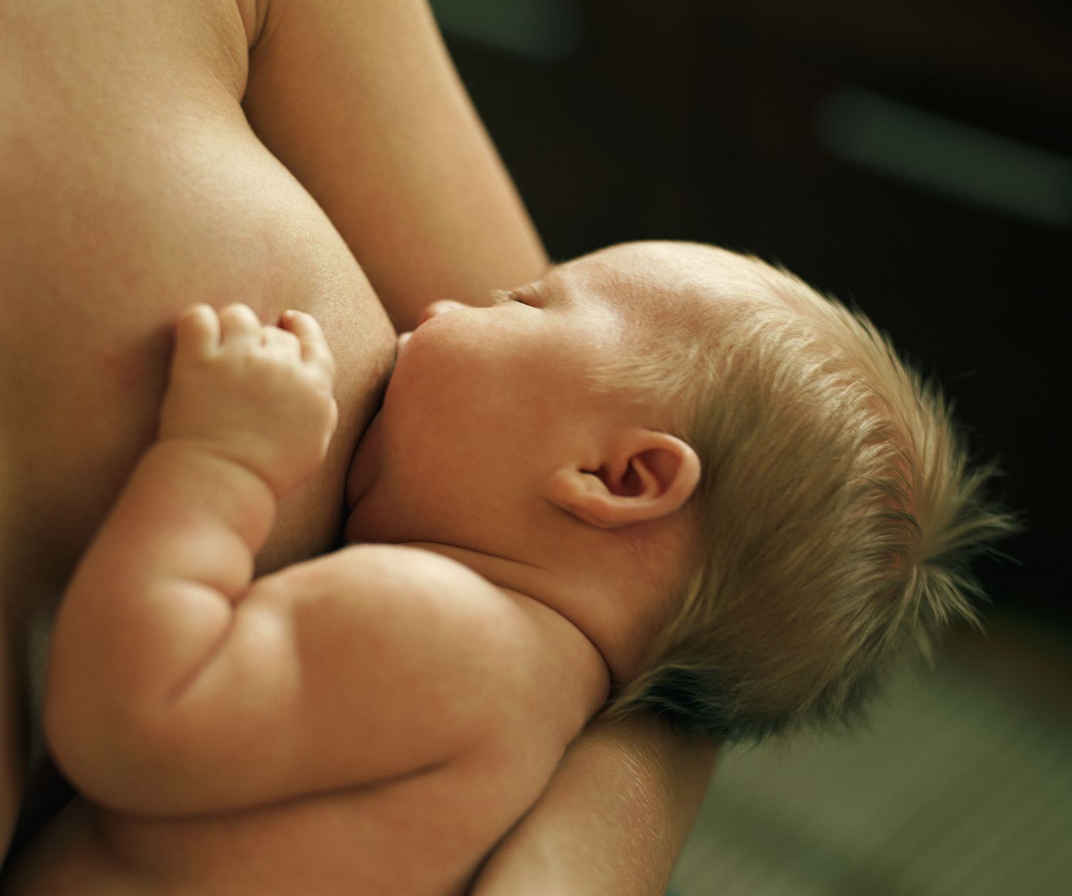 An image of a mother breastfeeding.