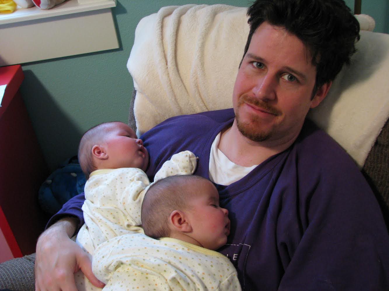 New dad holding twins