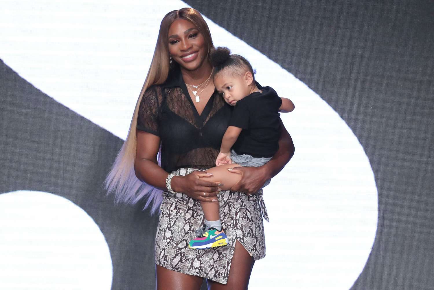 Serena Williams walks the runway with her daughter Olympia during S by Serena Williams Runway Show