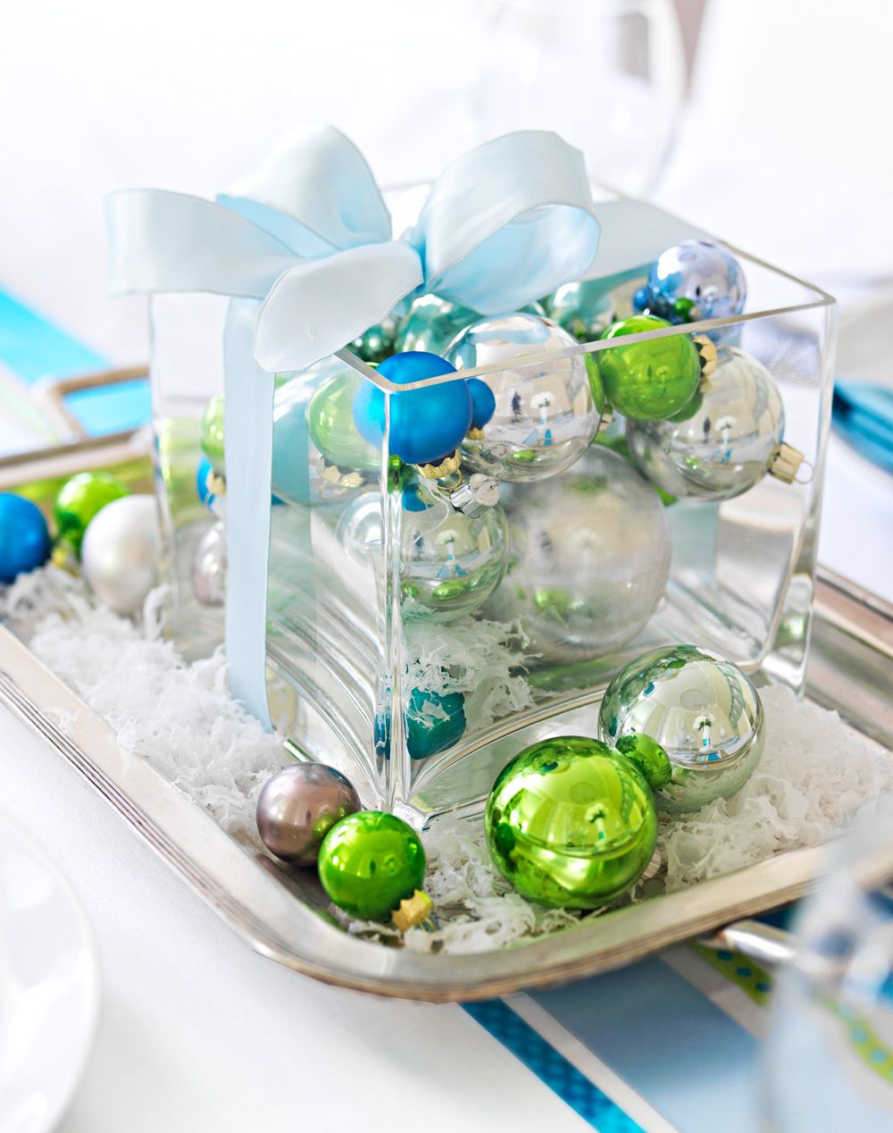Faux snow and ornaments centerpiece