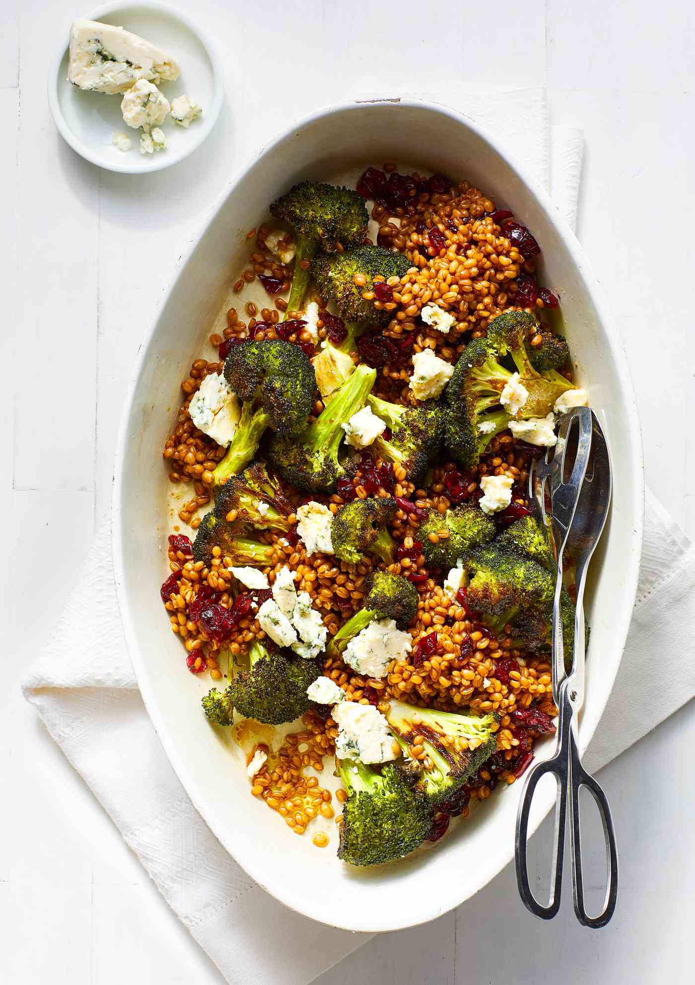 Roasted Broccoli with Wheat Berries, Blue Cheese and Cranberries in oval dish