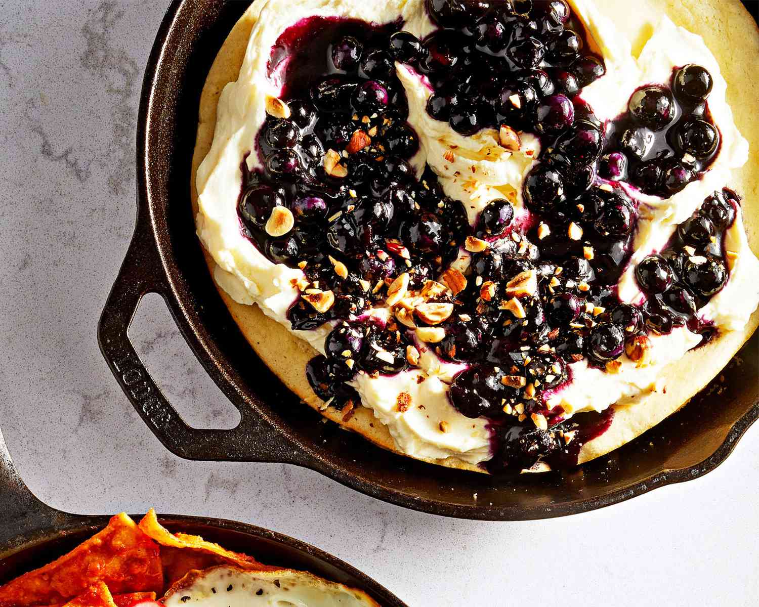 Ricotta Hotcake with Lemon Cream, Blueberry Syrup and Hazelnuts