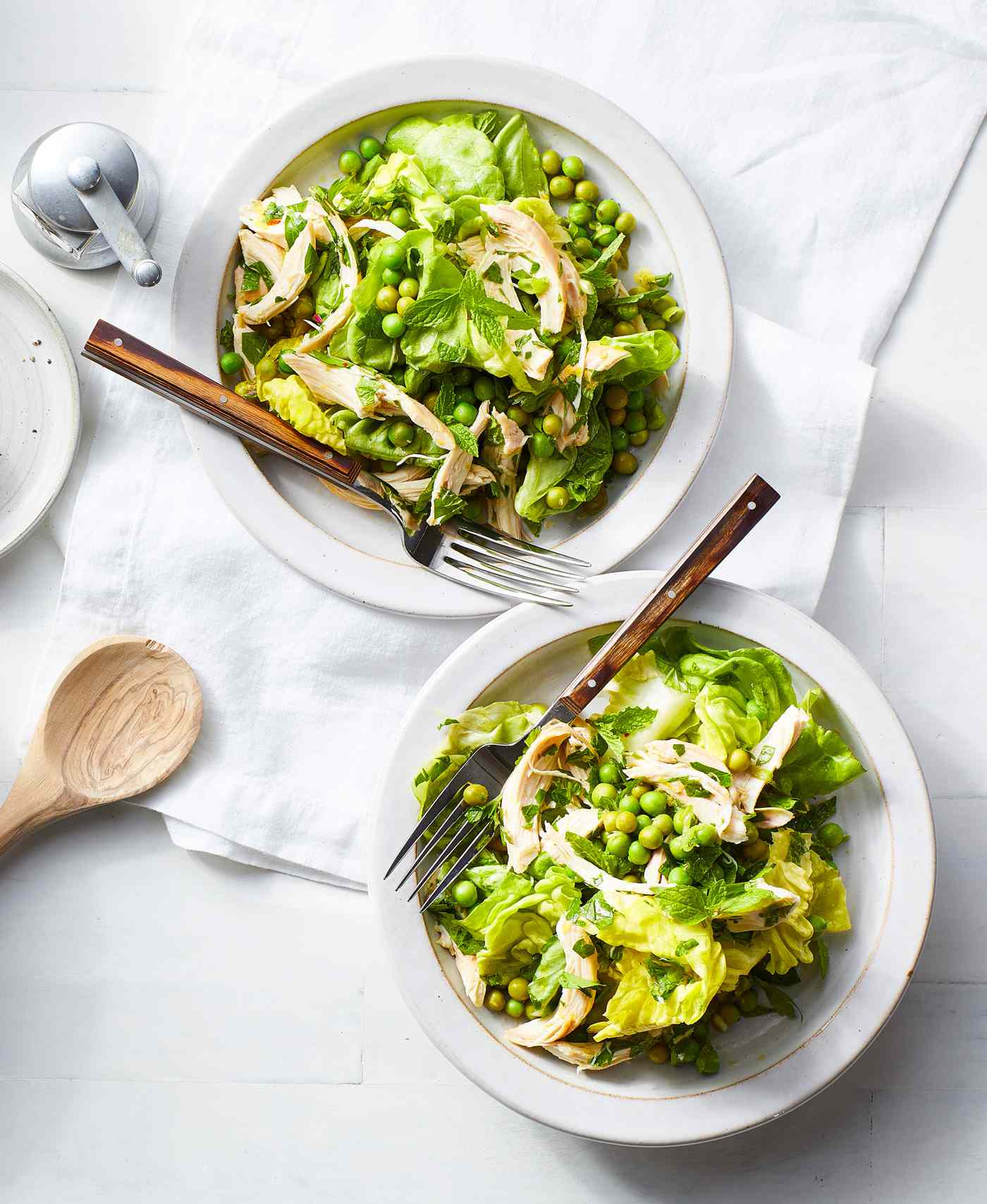 two plates of Green Salad with Chicken and Marinated Peas