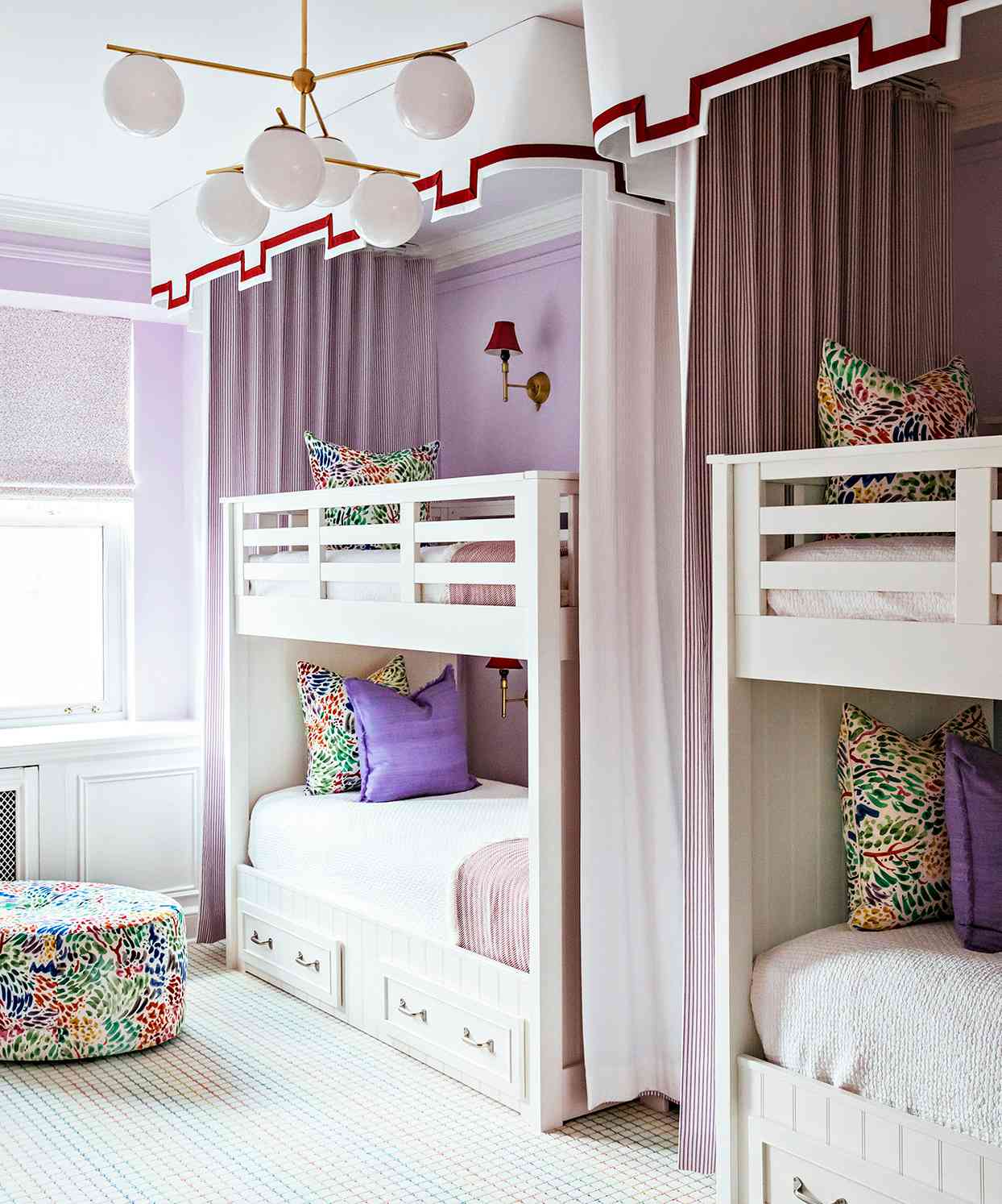 girls room twin bunk beds purple walls curtains bold pillows ottoman