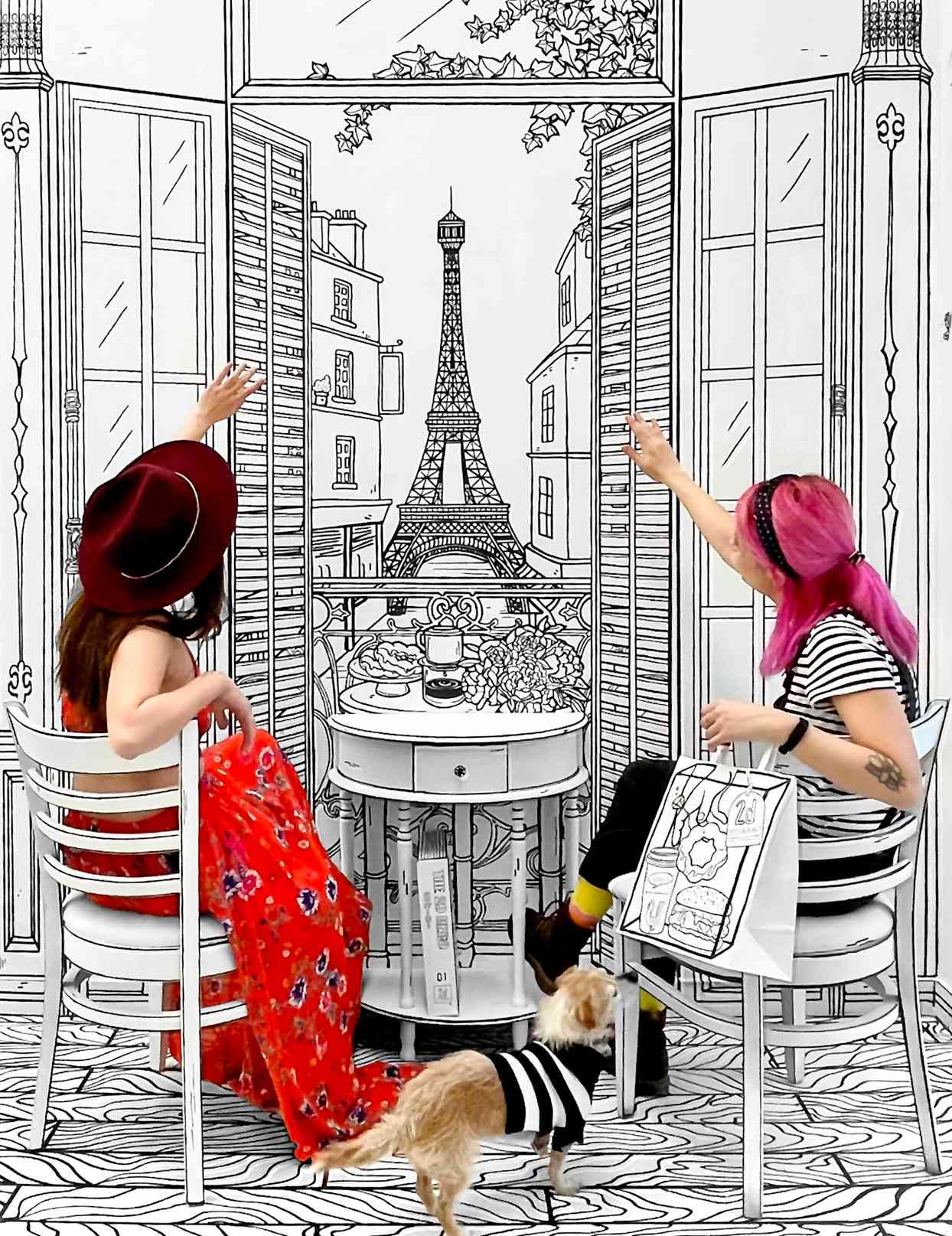 women at optical illusion cafe