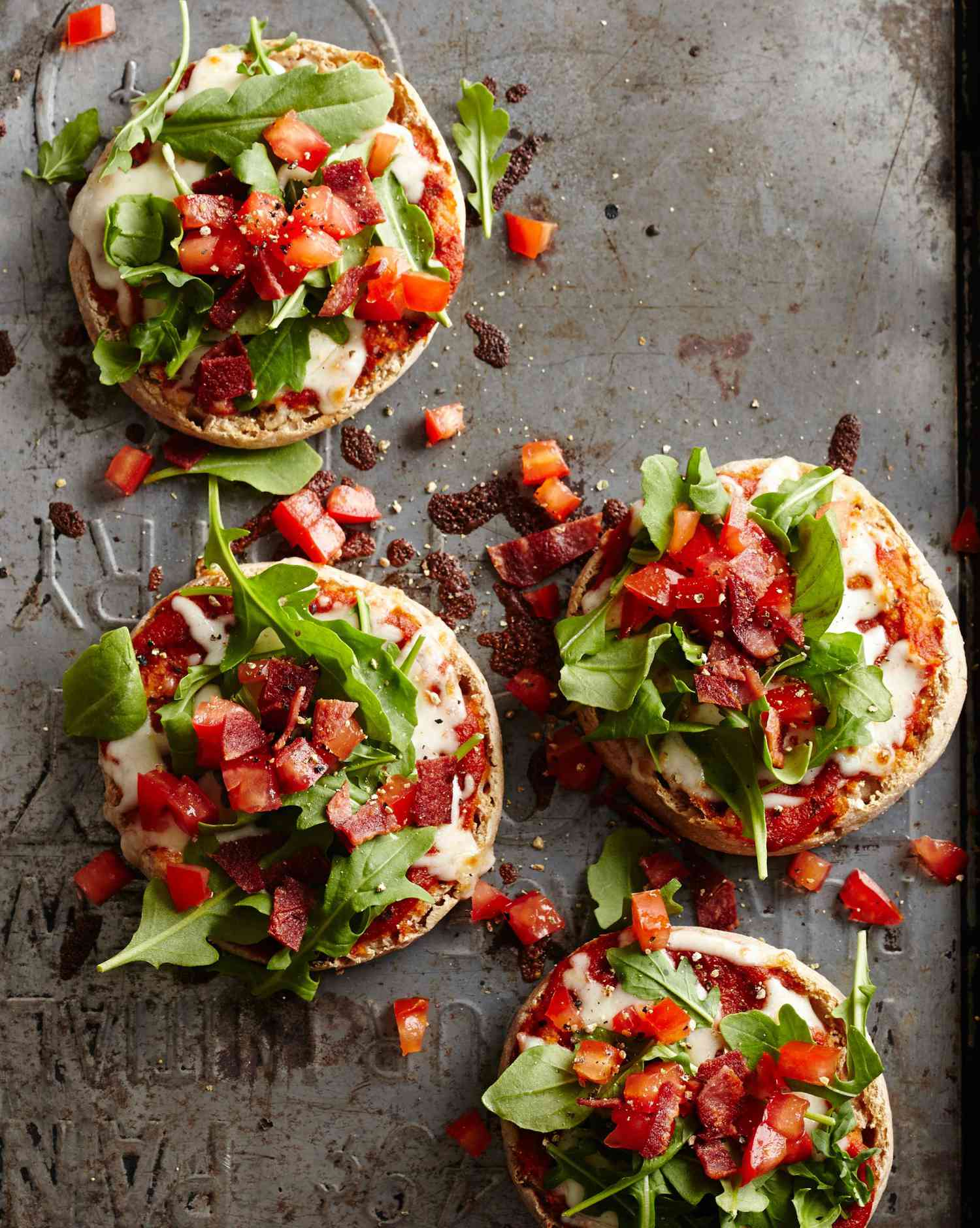 <p>Using English muffins in place of dough saves time and makes for easy portioning. Top with sauce, arugula, tomatoes, mozz and turkey bacon for a satisfying, crunchy lunch or quick dinner. </p>
                          