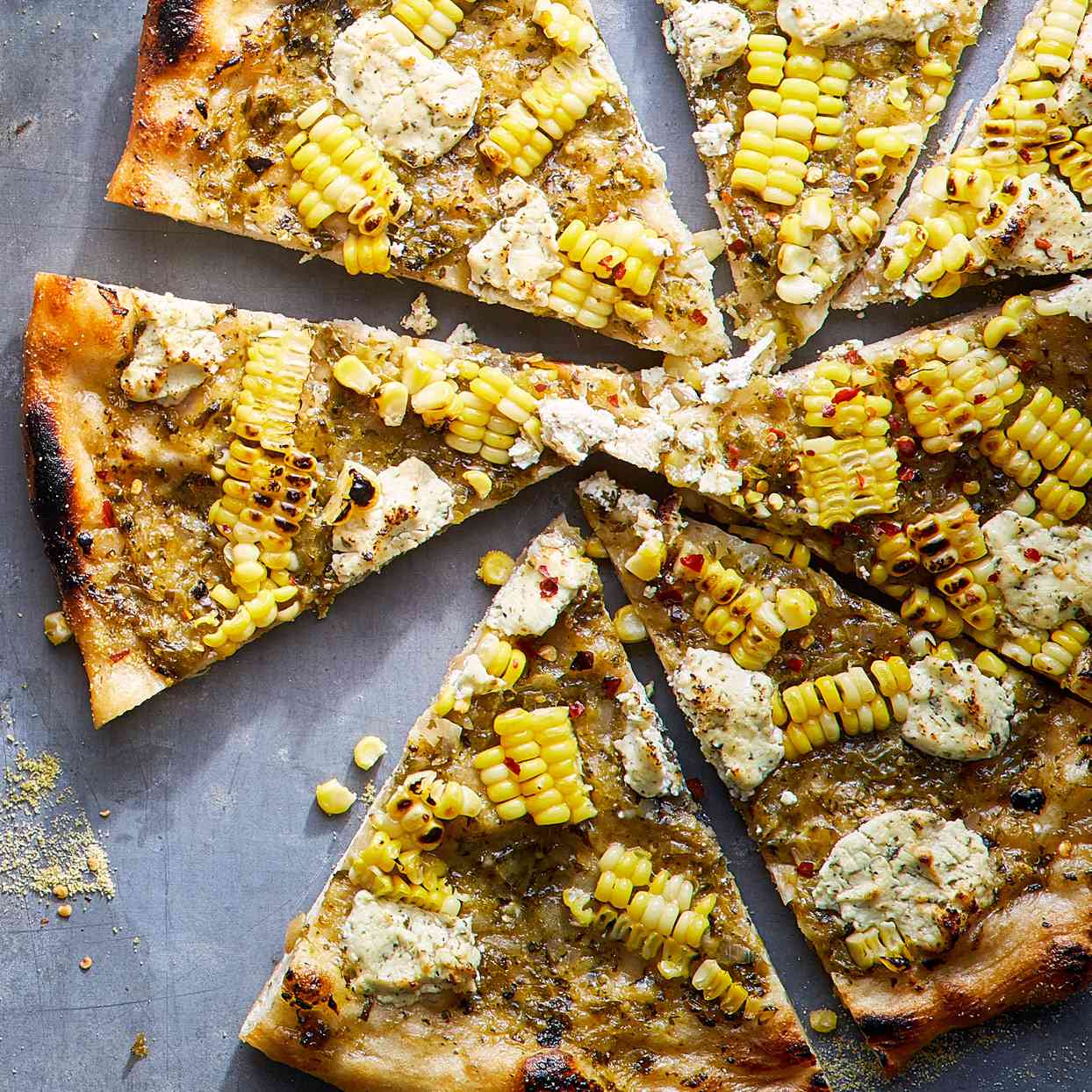 <p>When life leaves you one lonely ear of sweet corn, make this pizza, topped with green salsa, corn and goat cheese. It's a favorite at Millsap Farm's Pizza Club parties.</p>
                          