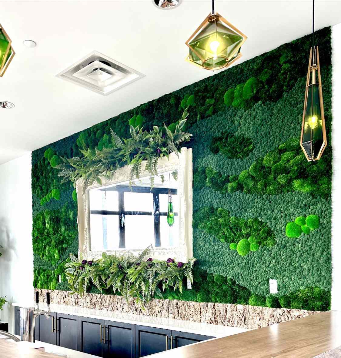 Living wall art installation above countertops by Planthropy
