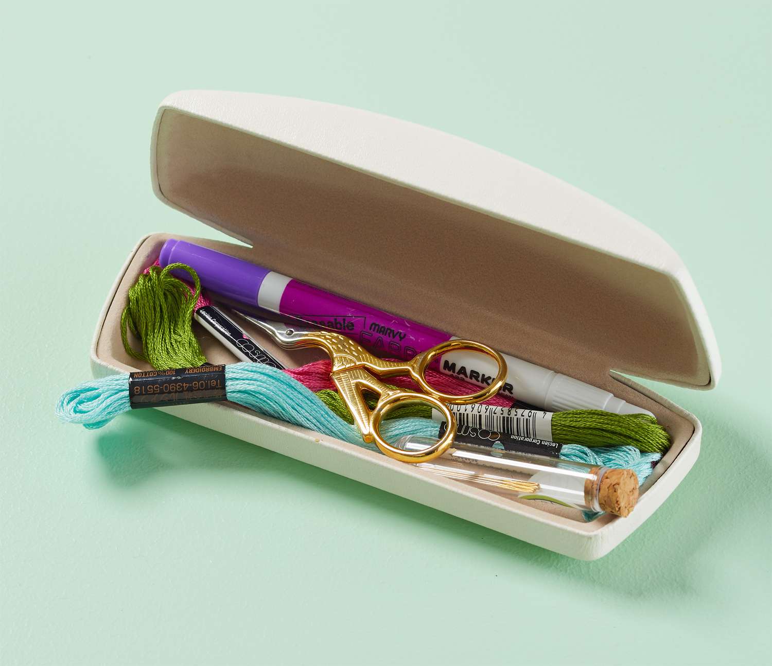 <p>Repurpose a hard-shell eyeglass case as a carrier for embroidery supplies. The case is long enough to contain embroidery floss, snips, needles, and a marking tool, and the hard exterior keeps sharp objects from poking through.</p>
                            