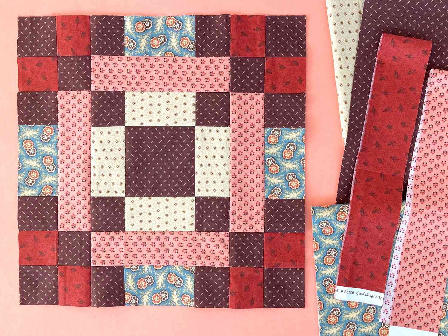 Block 11 in brown, red, pink and cream