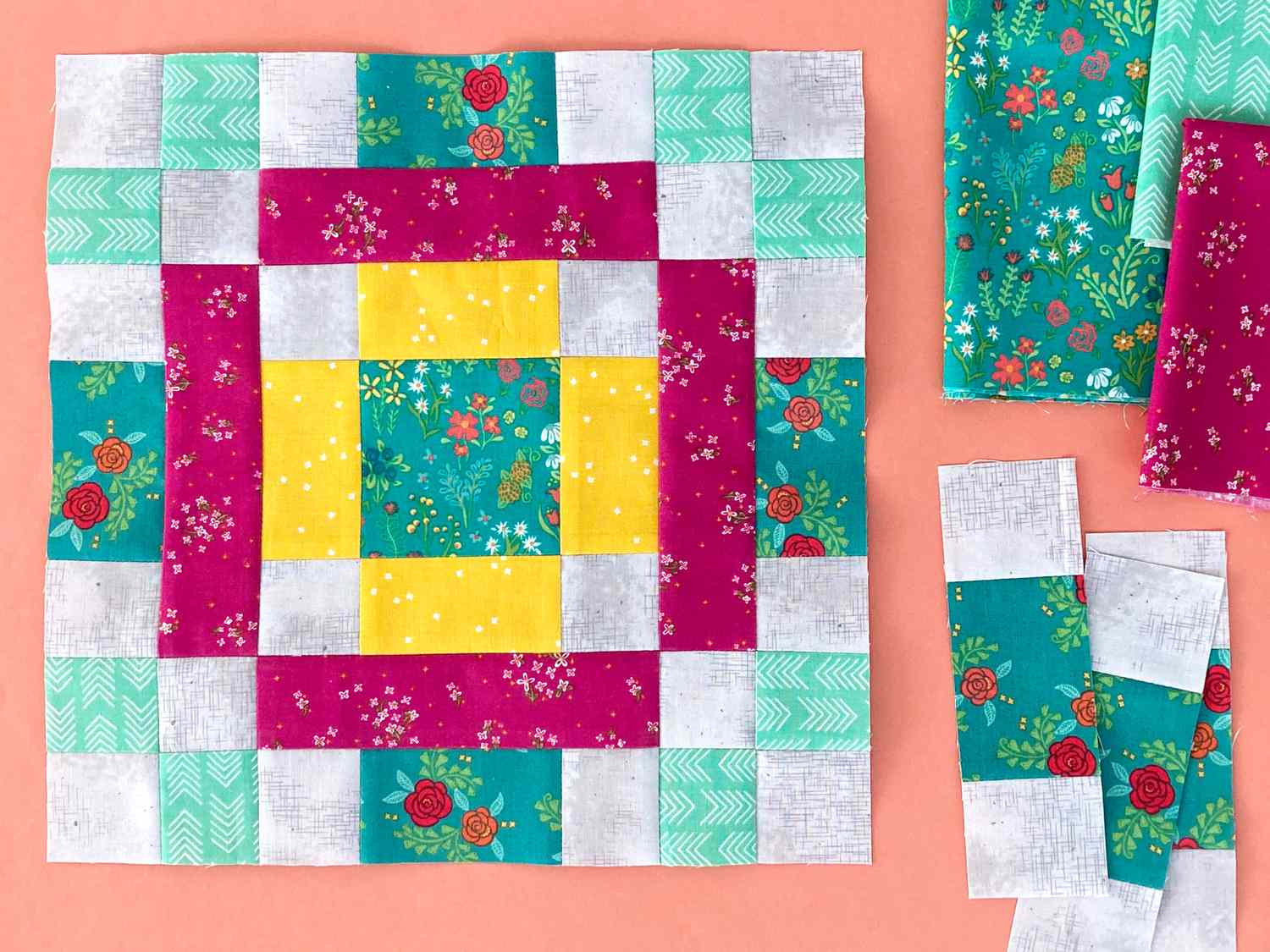 Block 11 made in teal, pink, and yellow florals