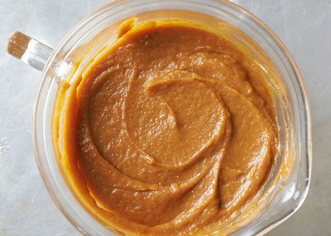 overhead shot of pumpkin puree in a glass measuring cup