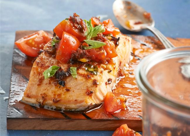 Planked salmon with cherry tomato and basil relish