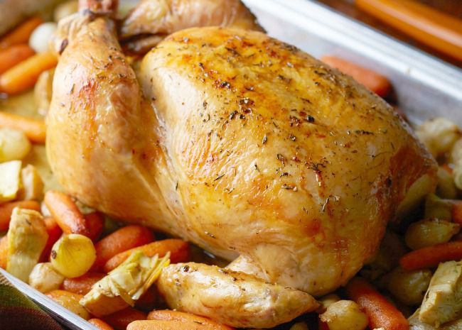 Roast Chicken in a roasting pan with vegetables