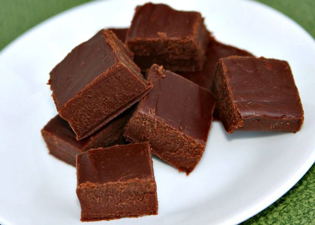 squares of smooth fudge on a white plate
