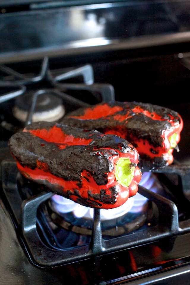 peppers roasting directly on gas stove flame