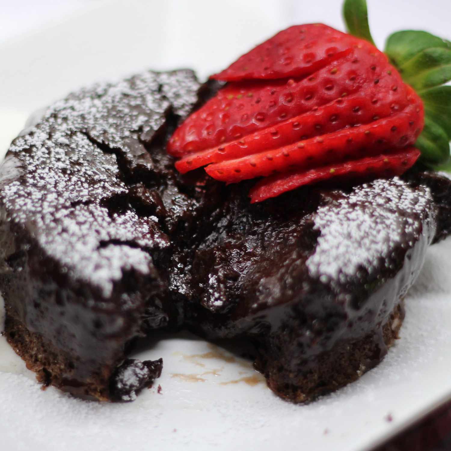 chocolate lava cake topped with a strawberry