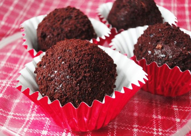 Basic Truffles rolled in cocoa powder and nested in candy cups