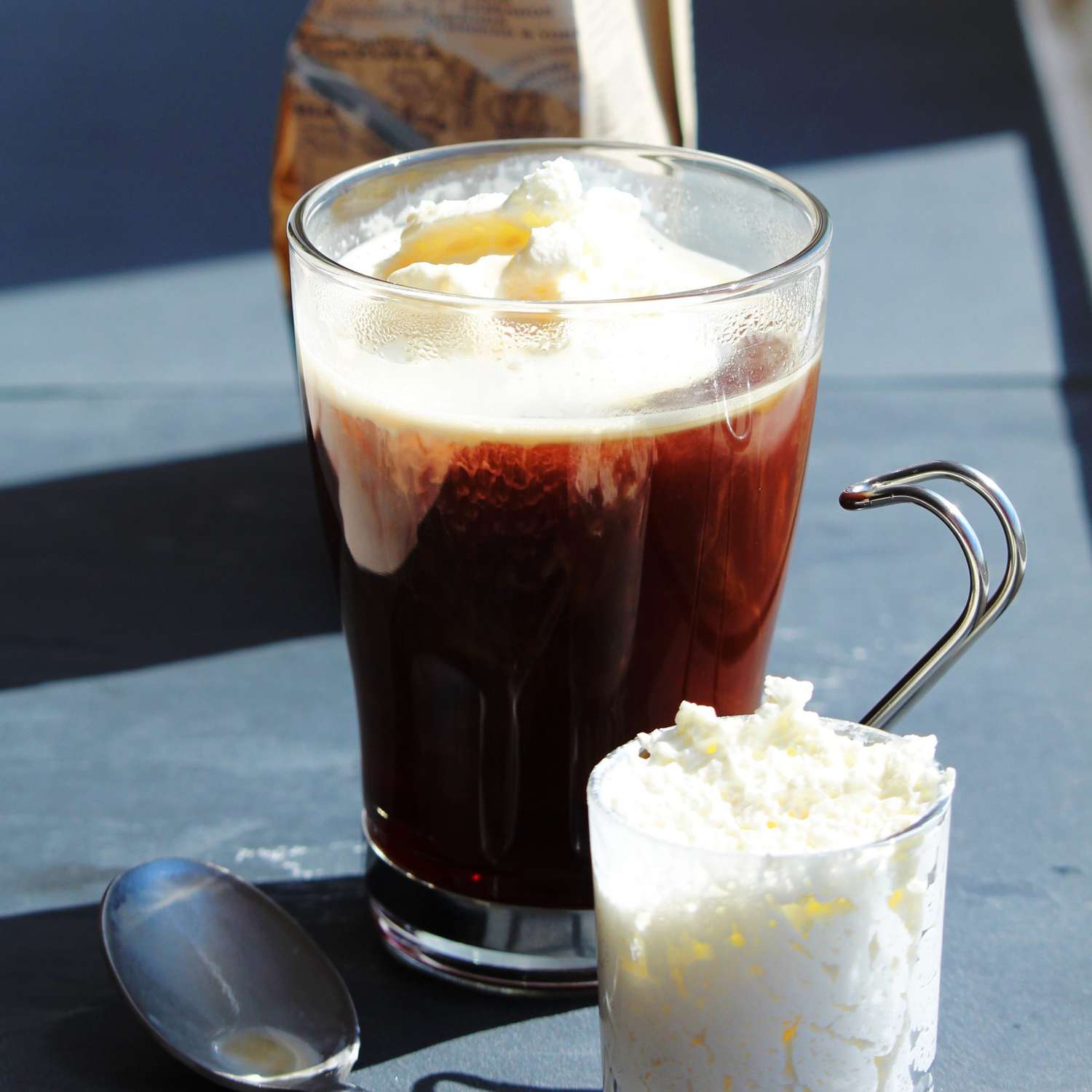 hot chocolate in a glass with whipped cream