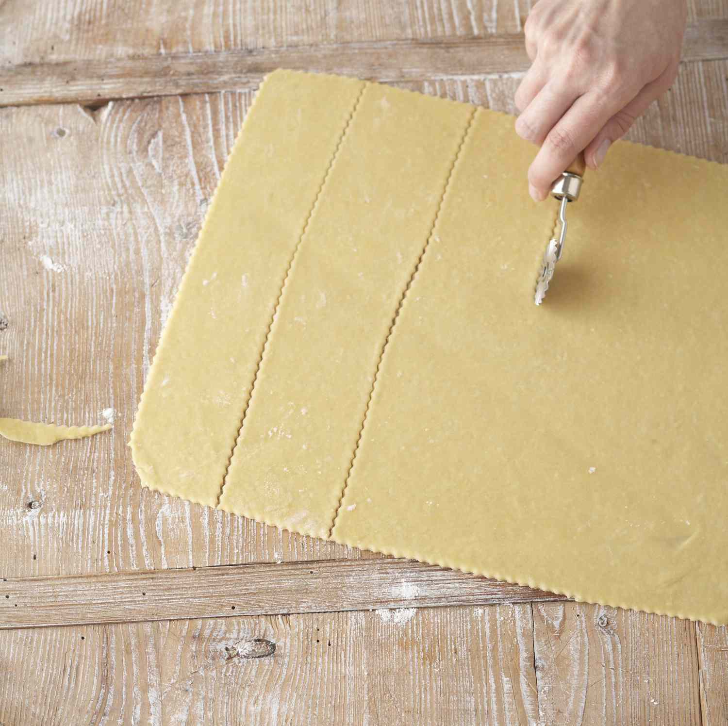 cutting dough into strips for ravioli