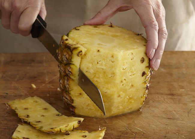 Trimming the Sides of a Pineapple