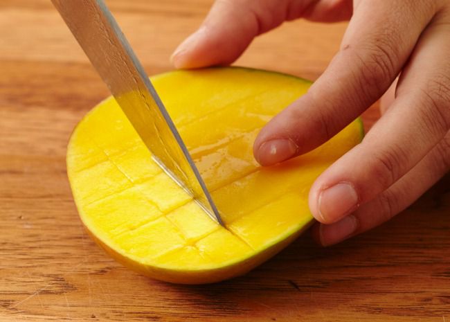 Slicing the mango into squares