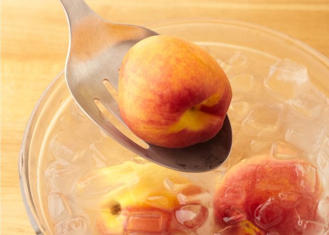 Shock Blanched Peaches in Ice Water
