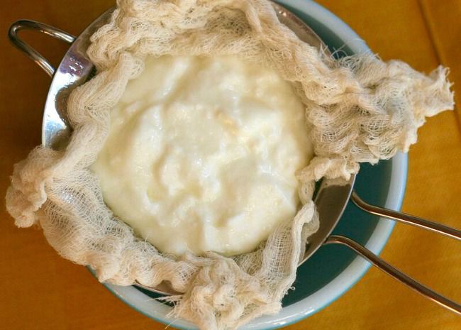 Straining Greek yogurt through cheesecloth