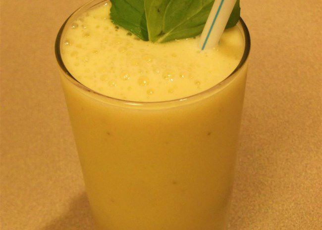 Apple Banana Smoothie in a glass with a mint garnish