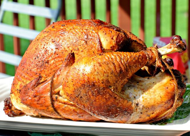 side view of a golden brown turkey on a platter