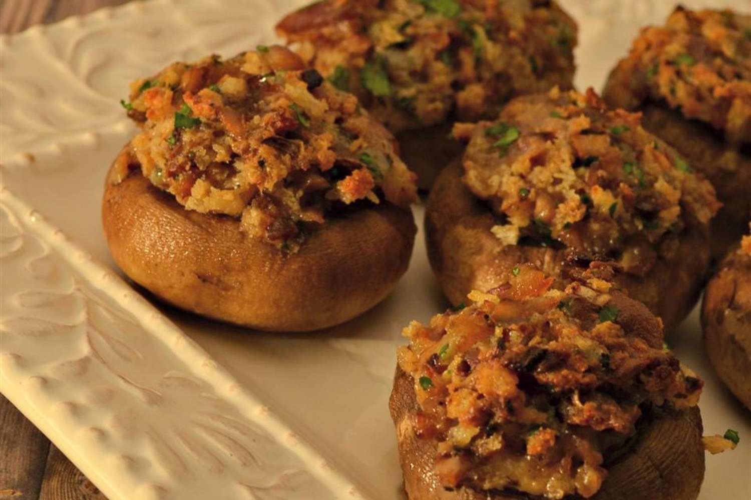 Blue Bacon Stuffed Mushrooms on white serving plate