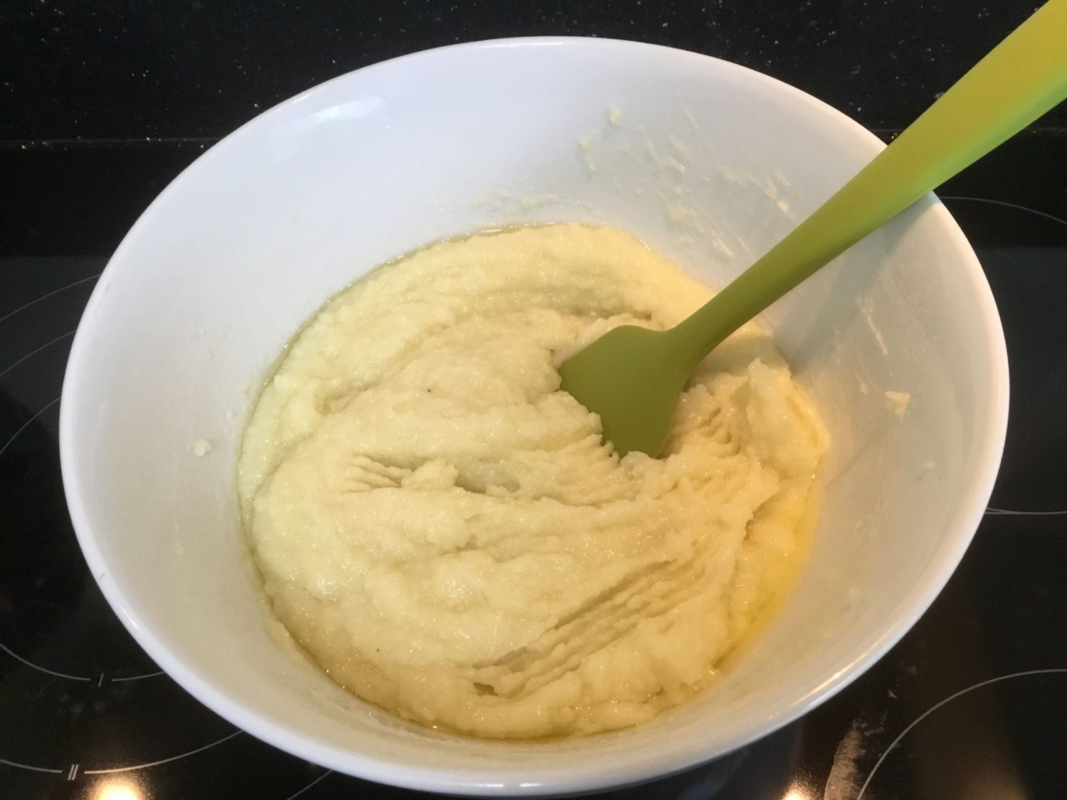 creamy spread in a white bowl with green fork