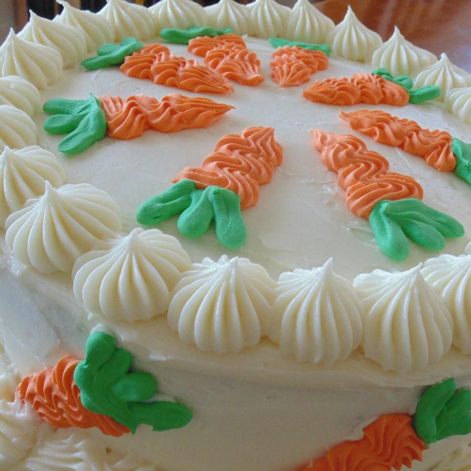 carrot cake with pineapple cream cheese frosting and icing carrots