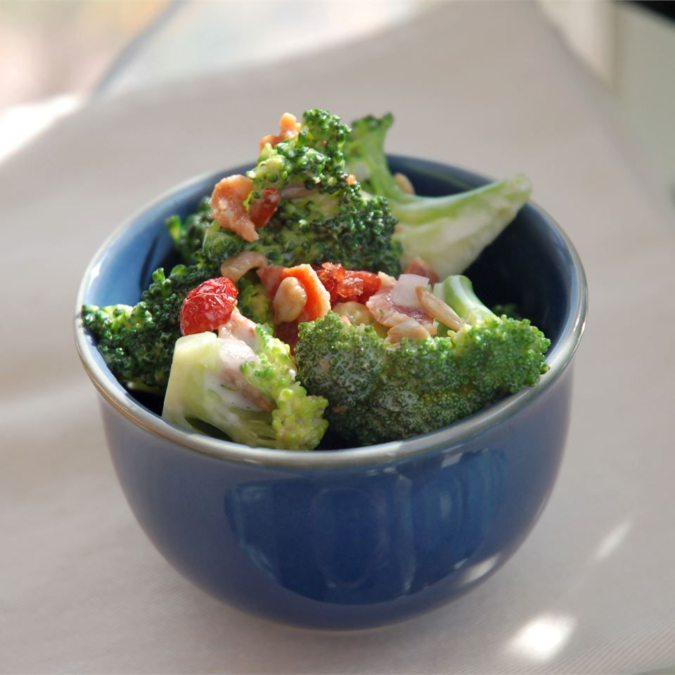 a serving of broccoli salad in a blue bowl