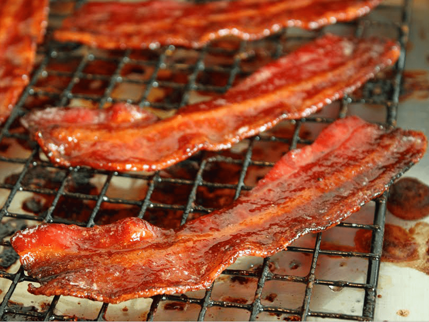 closeup of sugared bacon strips on a cooling rack