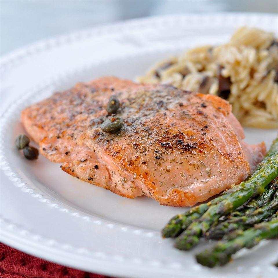Pan-Seared Salmon on a white plate with asparagus