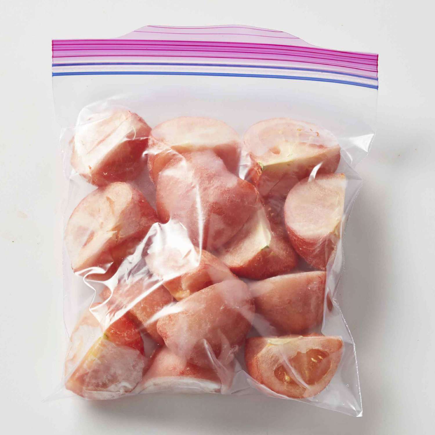 Frozen tomatoes in freezer bags