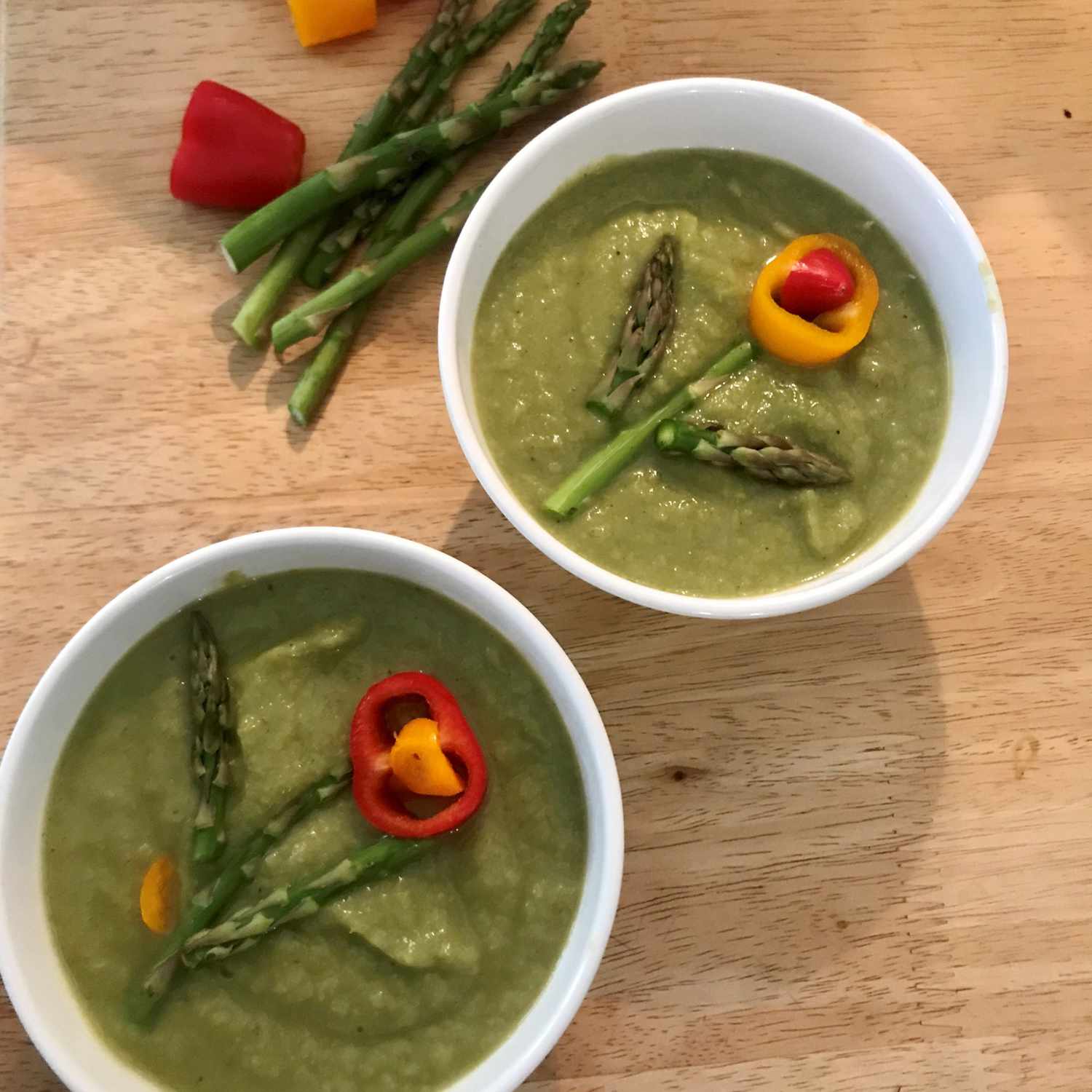 Two bowls of Creamy Asparagus and Cauliflower Soup