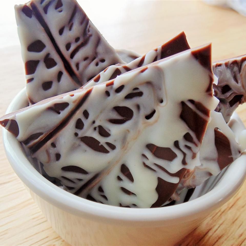 pieces of semisweet chocolate bark with white chocolate drizzle